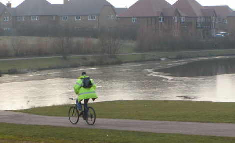cycling beside icy lake